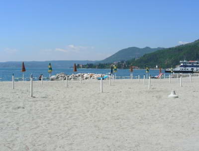 The large beach at Maderno complete with stands for sun shades