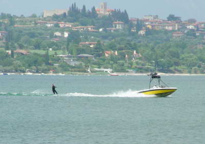 Waterskier with Moniga castle in the background.