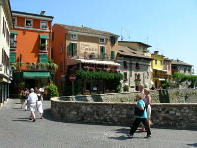 A typical narrow and colourful street in Sirmione A typical narrow and colourful street in Sirmione